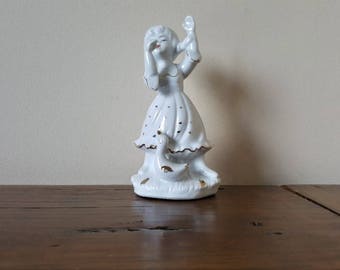Little dancing girl figurine.