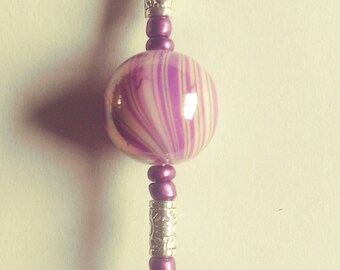 Purple zipper pull with a butterfly charm