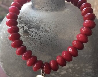 Sophisticated, 8mm red Brazilian ruby gemstone bead bracelet with a handmade JOY dangling charm,
