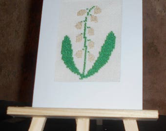 Embroidered card on canvas with a strand of the Valley