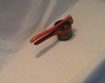 1940's vintage red handles potato ricer