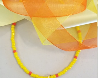 Little yellow ducky necklace lamp worked glass duck on a strand of yellow and orange glass seed beads.