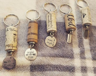 Wine cork keychain with charm.