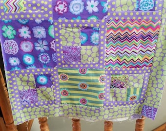 Quilt top lap or baby featuring Kaffe Fassett collective fabrics in greens and lavenders 58.5 x 45 inches