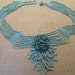Vintage Turquoise colored beaded necklace with Floral design with tassels, Rare