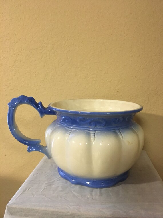 Vintage porcelain blue and white chamber pot with handle