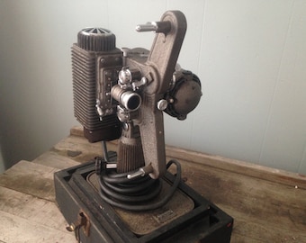 Vintage film projector, 1948 Revere Eight Projector in case with manual