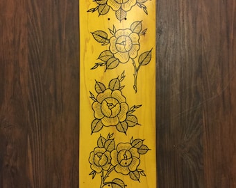 Gold rose skateboard art