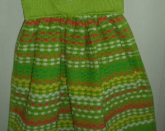 Bright green hang towel with a flower button