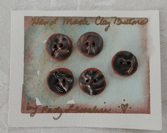 Five Clay Buttons on a Card