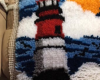 Lighthouse On The Shore