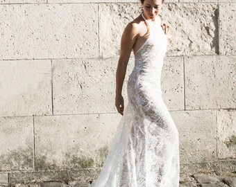 Backless Lace Wedding Dress | Sheer Halter Neckline with Low Back leading into a Fitted Skirt and Cathedral Train