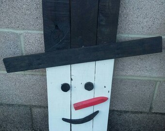Snowman made from 100% reclaimed pallet wood.