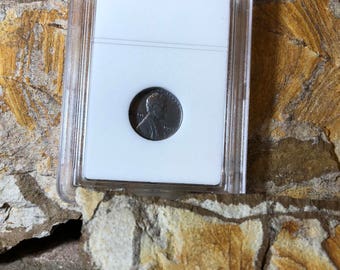 1943 steel wheat penny encapsulated in circulated condition