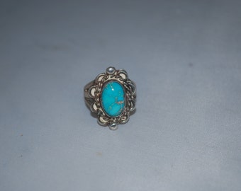 Sterling silver ring size 4 with turquoise.