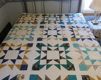 Homemade handmade twin bed blue gold and teal star quilt