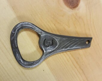 Hand forged damascus bottle opener
