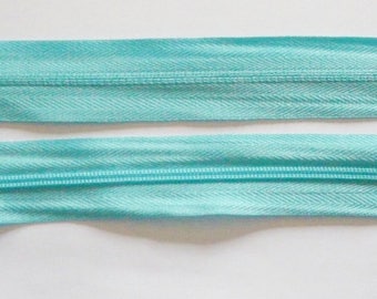 Zipper zips light blue