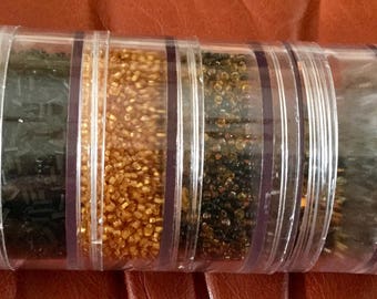 Six Containers of Seed Beads, Clear, Black, Gold, Brown Mix and Black and Clear Mix