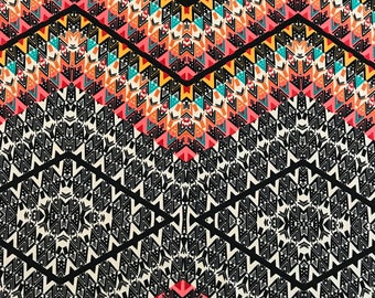 Abstract print on a poly rayon blend stretch knit fabric
