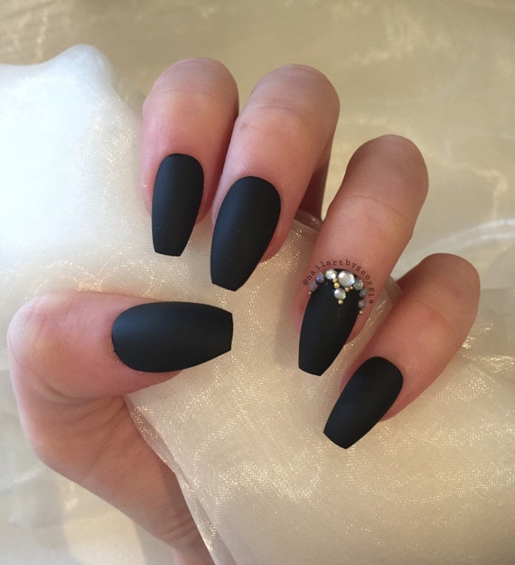 Matte black coffin nails with rhinestones and gold beads