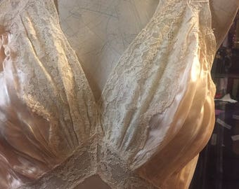 A waterfall of lightweight peach satin and lace: a 1930s nightgown / slip in full length