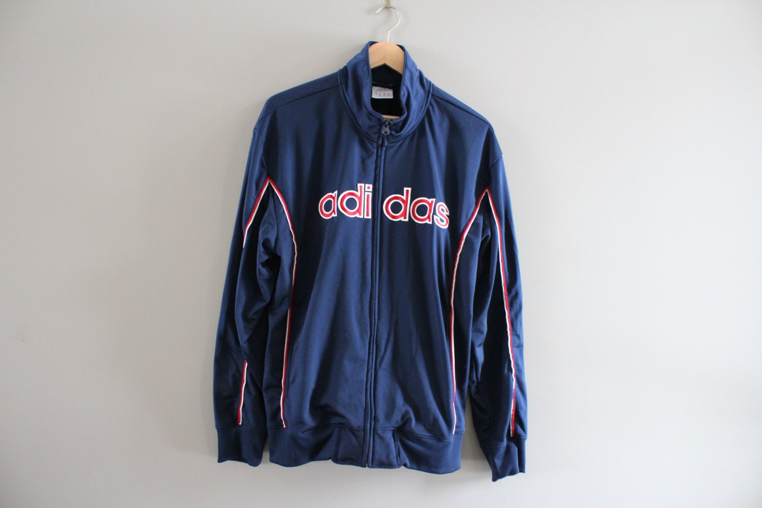 navy blue and red adidas jacket