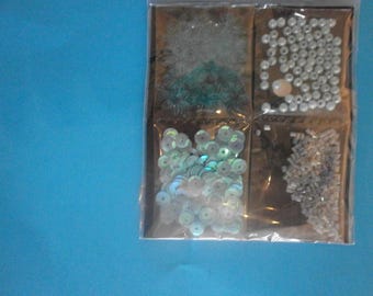 assortment of beads on blue
