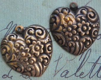 TWO Victorian brass heart charms with flowers, natural discoloration