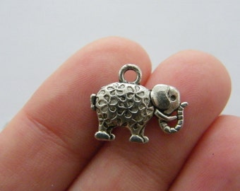 8 Elephant charms antique silver tone A496