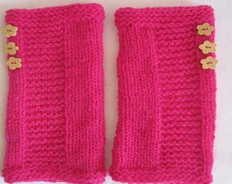 Pink mittens with flower buttons