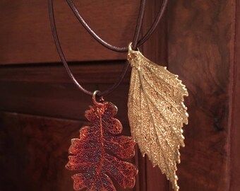 luxuriant leather necklace with 2 electroplated leaf pendants