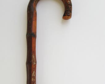 Walking cane, walking stick, vintage made of wood.