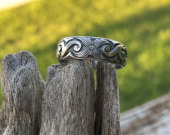 Sterling silver engraved ring band.