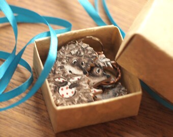 Keychain. Hedgehog with a bag