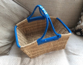 Original 1950s vintage wicker shopping basket blue trim.
