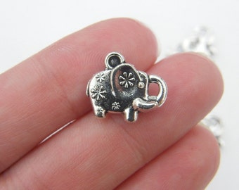8 Elephant charms antique silver tone A534