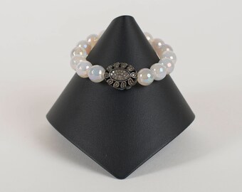 Pave diamond focal bead on mystic moonstone beads