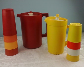 Set of vintage tupperware. Two pitchers and eight cups in harvest colors.