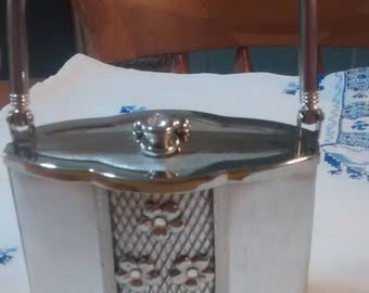 A white metal and brocade evening bag