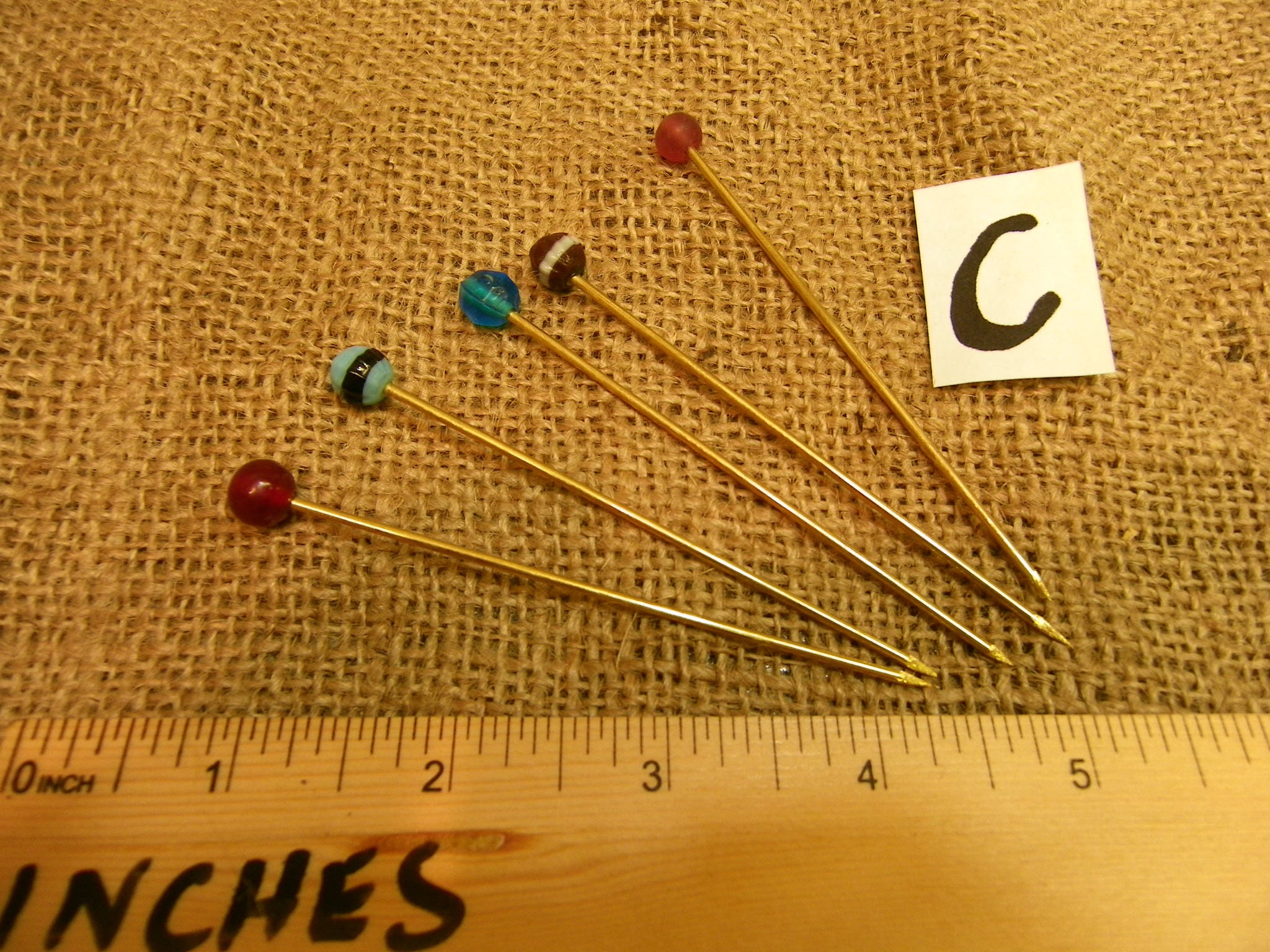 glass headed bronze dress pins set of 5 roman to anglo saxon