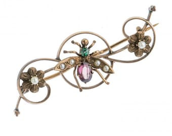 Victorian insect pin in rose gold with blue zircon, garnet and seed pearls. pnvc764