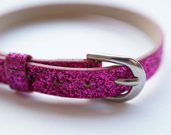 fuchsia glitter leather bracelet.