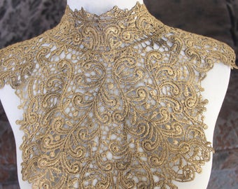 Cute venice applique black color with gold touch 1 piece listing 15 inches wide at the neck 4 1/2 inches wide the the shoulders