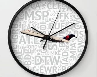 Delta Airlines 717 with Airport Codes - Wall Clock