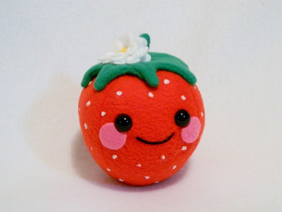 Plush strawberry toy with flower