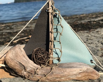 Decorative driftwood sailboat