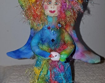 Enchanting fiber sculpted rainbow angel, silk face and Swarovski crystal accents