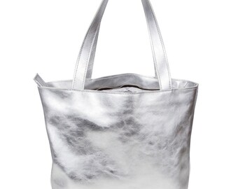 A large silver leather hobo bag