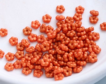 WHOLESALE LOT. Eight bags of approximately 100 Forget Me Not glass flower beads in Orange Goldshine per bag. Beadwork, Jewelry supply.